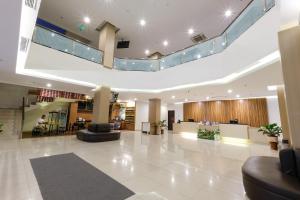 a lobby of a hospital with couches and chairs at Hotel 88 Mangga Besar 62 Lokasari By WH in Jakarta