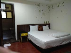 Postel nebo postele na pokoji v ubytování Mingyuan Homestay