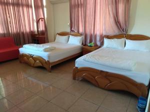 Postel nebo postele na pokoji v ubytování Mingyuan Homestay