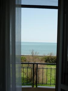 a room with a window looking out at the ocean at Casa Murazzi in Venice-Lido
