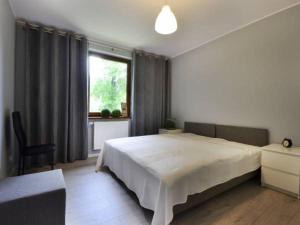 Posteľ alebo postele v izbe v ubytovaní Apartament SONIA