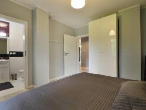 Posteľ alebo postele v izbe v ubytovaní Apartament SONIA