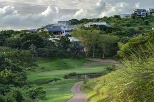an aerial view of a golf course with houses at Apartments on The Eighteenth at Prince's Grant Golf Estate in Blythedale
