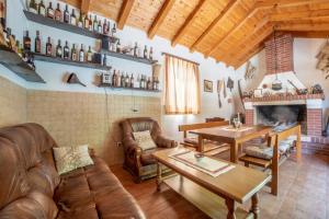 a living room with leather furniture and a fireplace at Villa Lucija in Gruda