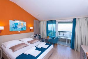Postel nebo postele na pokoji v ubytování Apartments Villa Loznica