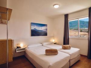 Llit o llits en una habitació de Route Active Hotel