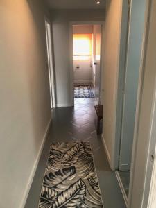 a hallway with a zebra print rug on the floor at Campello Mistral in El Campello