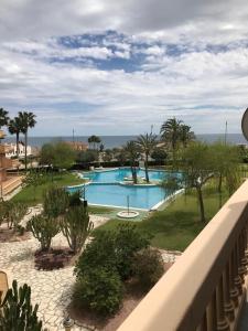 a view of a pool from a balcony of a resort at Campello Mistral in El Campello