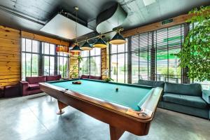 a billiard room with a pool table at 3 Mountains Hotel in Bansko