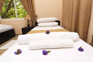 Voodi või voodid majutusasutuse Peacock Resort toas