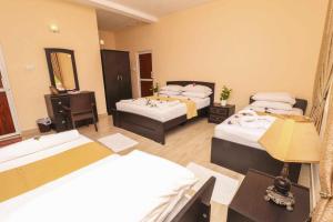 Voodi või voodid majutusasutuse Peacock Resort toas
