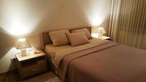 Ένα ή περισσότερα κρεβάτια σε δωμάτιο στο Apartamentai Dainų