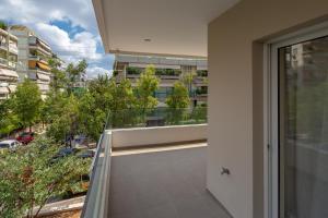 a balcony with a view of a building at Sagittarius - Faliro Sea Side apartment in Athens