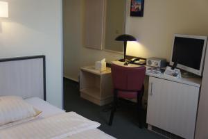 Ein Bett oder Betten in einem Zimmer der Unterkunft Parkhotel Neubrandenburg