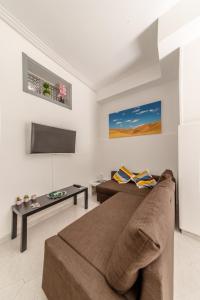 Televízia a/alebo spoločenská miestnosť v ubytovaní Carlentini house B&B