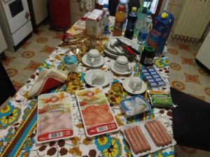 a table with food and snacks on it at B&B Cavour in Carlentini