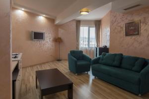 a living room with a couch and a table at Hotel Kardjali in Kŭrdzhali