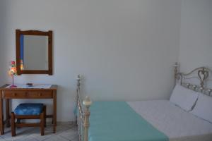 Postel nebo postele na pokoji v ubytování Ammos Holiday House