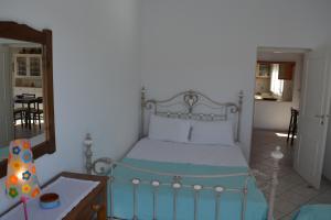 Postel nebo postele na pokoji v ubytování Ammos Holiday House