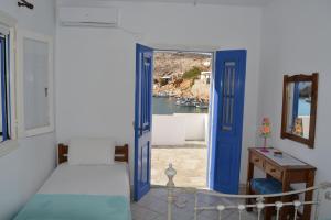 Postel nebo postele na pokoji v ubytování Ammos Holiday House