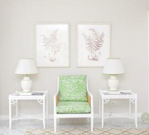 a room with two tables and a chair and two lamps at Cobblers Cove - Barbados in Saint Peter