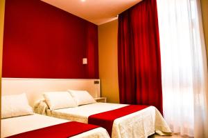 Postel nebo postele na pokoji v ubytování Hostal Playa Candor
