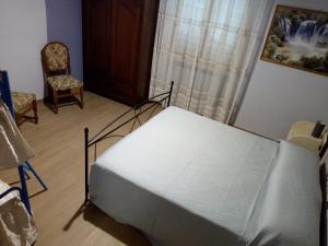 Łóżko lub łóżka w pokoju w obiekcie AGRITURISMO NIZUR'IN