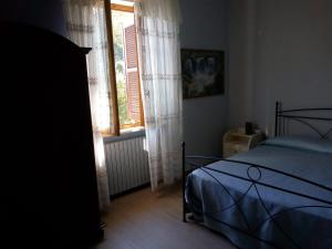 Łóżko lub łóżka w pokoju w obiekcie AGRITURISMO NIZUR'IN
