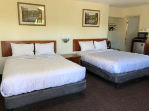 Postel nebo postele na pokoji v ubytování Monticello Motel