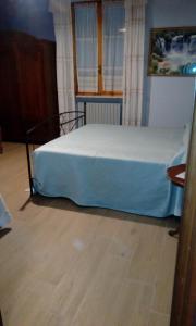 Łóżko lub łóżka w pokoju w obiekcie AGRITURISMO NIZUR'IN