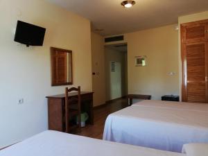 A bed or beds in a room at Labella María