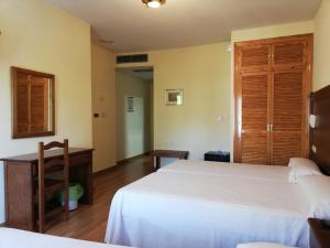 A bed or beds in a room at Labella María