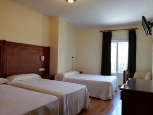 A bed or beds in a room at Labella María