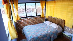 Postel nebo postele na pokoji v ubytování Hostal La Isla