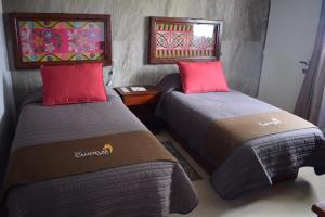 Postel nebo postele na pokoji v ubytování Hotel Las Candelas de Huamantla