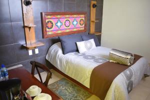 Postel nebo postele na pokoji v ubytování Hotel Las Candelas de Huamantla