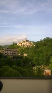 a building on top of a hill with trees at Cà Feddia in Bagnone