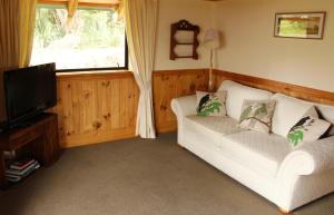 Postel nebo postele na pokoji v ubytování The Cottage Wai Rua