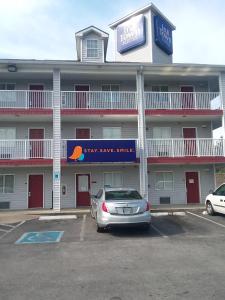 a car parked in a parking lot in front of a hotel at InTown Suites Extended Stay Nashville TN - Murfreesboro Pike in Antioch