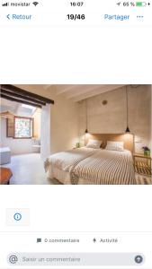 a bedroom with a large bed in a room at Font Fresca House in Deia