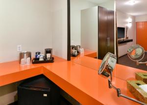 a kitchen with a sink and a counter top at The Tangerine in Burbank