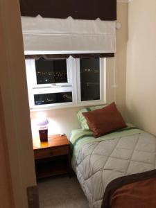 Cama o camas de una habitación en departamento nuevo equipado