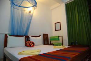 Postel nebo postele na pokoji v ubytování Vishmee Holiday Inn