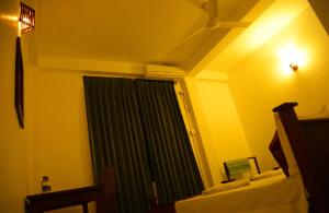 Postel nebo postele na pokoji v ubytování Vishmee Holiday Inn