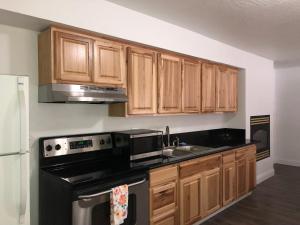 A kitchen or kitchenette at Cedar Inn & Suites