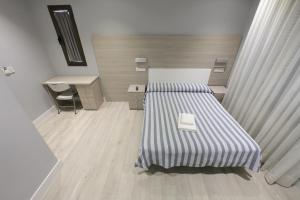 Ένα ή περισσότερα κρεβάτια σε δωμάτιο στο Hotel Goizalde