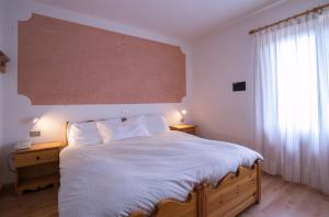 Postel nebo postele na pokoji v ubytování Hotel Lares