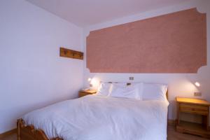 Postel nebo postele na pokoji v ubytování Hotel Lares