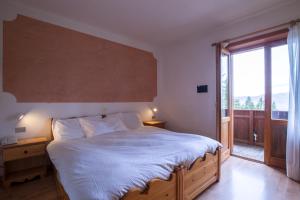 Cama ou camas em um quarto em Hotel Lares