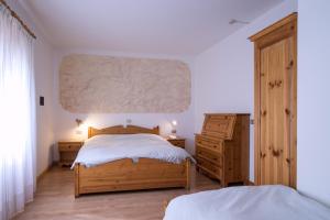 Postel nebo postele na pokoji v ubytování Hotel Lares